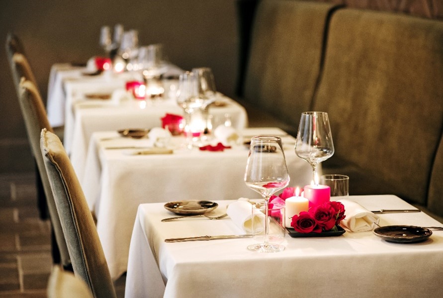 A row of tables decorated for Valentine's Day