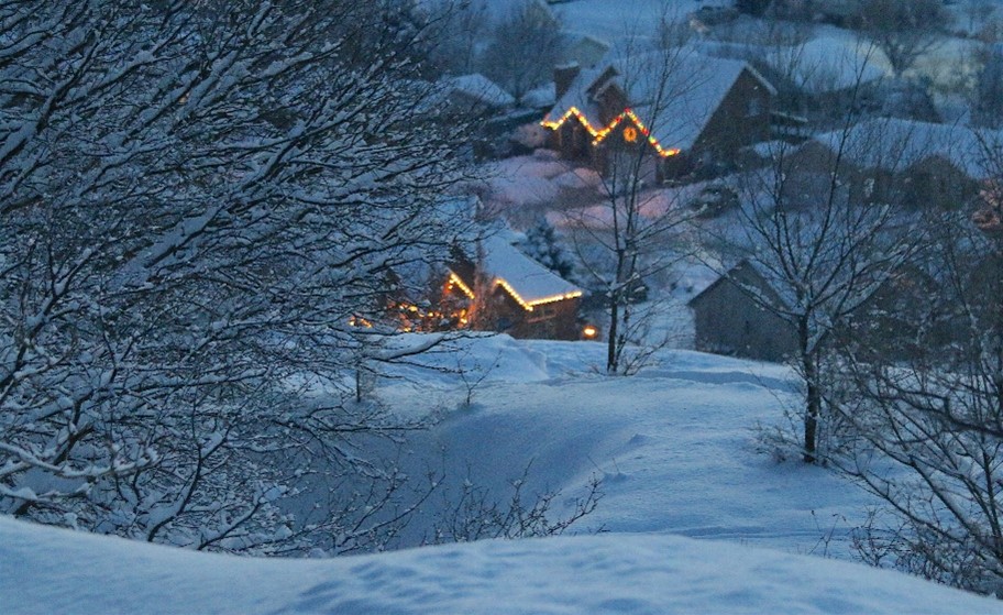 Two houses covered in snow